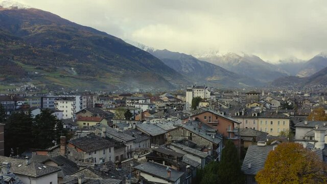A majestic look of the Valle d&rsquo;Aosta, Italy, with amazing clave snow-capped mountains, and rooftops, A Drone view.
