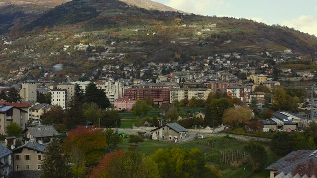 A majestic look of the Valle d&rsquo;Aosta, Italy, with amazing clave snow-capped mountains, and rooftops, A Drone view.