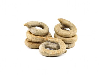 Taralli made of burned wheat with added of olive oil on  white background. They are a southern italian snack food, type cracker.,