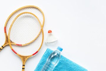Sports equipment with badminton rackets towel and water