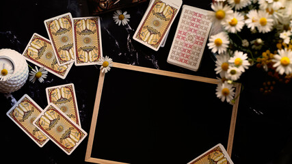 Fototapeta na wymiar Tarot cards on the table, fortune telling and predictions with copy space
