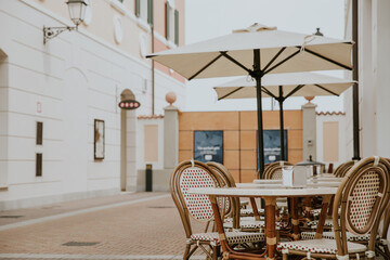 An empty table in the outdoor restaurant or cafe in Venice outlet.