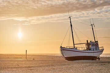 view of a boat on land on the beach