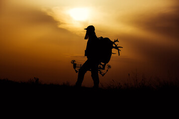 Fototapeta na wymiar Silhouette of a bow hunter