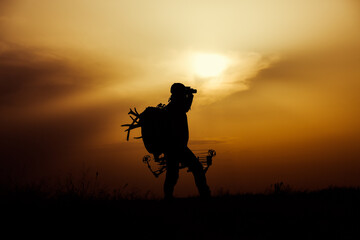 Fototapeta na wymiar Silhouette of a bow hunter