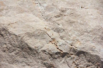 the texture of a gray stone with cracks