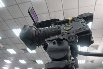 TV camera in the press conference room.