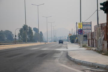 foggy highway due to fire smoke in Rhodes island 