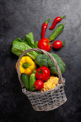 Fototapeta na wymiar Basket with fresh garden vegetables