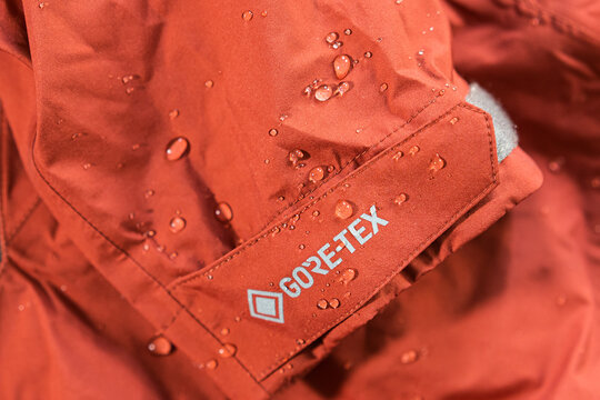 Prague, Czech republic, August 10, 2021. Detail photo of a waterproof gore-tex jacket with water droplets on it. 
