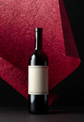 Red wine bottle with empty label.