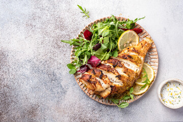 Pan roasted sea bass fish and green salad