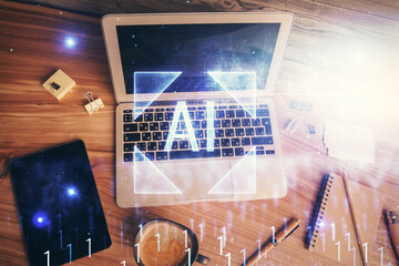 Double exposure of data hologram sketch over study table background with computer. Concept of Ai....