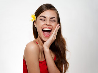 happy woman with flower in hair wide open mouth laugh emotion fun