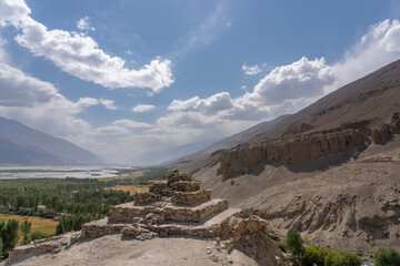 Scenic landscape view of ancient buddhist stupa overlooking the Wakhan corridor and Panj river valley in Vrang, Gorno-Badakshan, Tajikistan