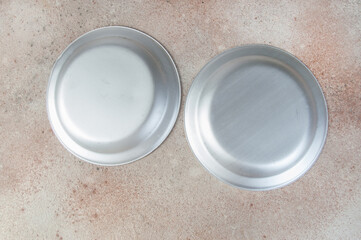 Old metal plates on concrete background.