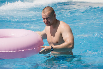 young healthy man in a water park