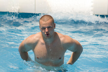 young healthy man in a water park