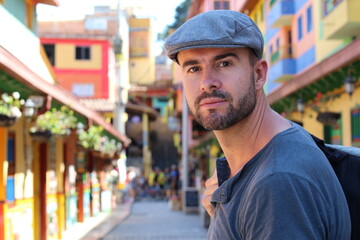 30 years old man walking around with his backpack 