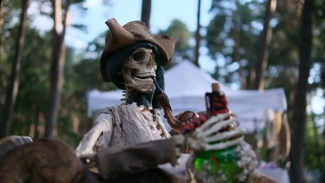 Decoration of pirate skeleton holding poisonous potion in hands