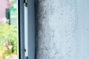 Mould and rot on window slope. House need repair.