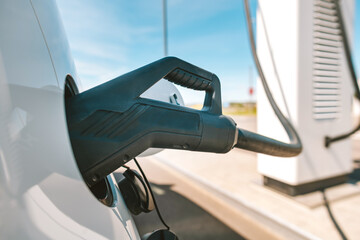 Closeup view of electric car charging cable at a charging station