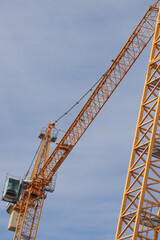 Fototapeta na wymiar Construction crane for multi-storey construction.