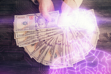 Multi exposure of vr glasses drawing hologram and USA dollars bills and man hands.