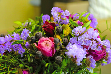 Selective focus. Dried bouquet of flowers in a vase.