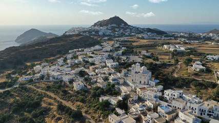 Obraz premium Aerial drone photo of picturesque uphill village of Tripiti with great views to bay of Adamantas near main town and capital of Milos island, Cyclades, Greece