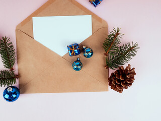 Christmas tree in envelope, minimal New Year s card. Spruce branch on pink background. Holidays, Congratulation concept, blue ball