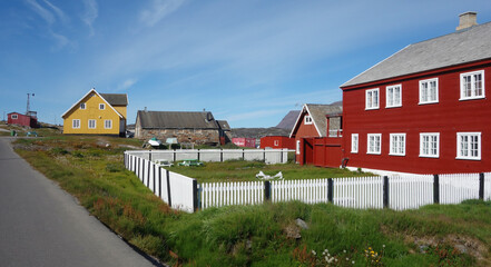 Fototapeta na wymiar colorful houses in the country, Qegerstarsquaq, Greenland