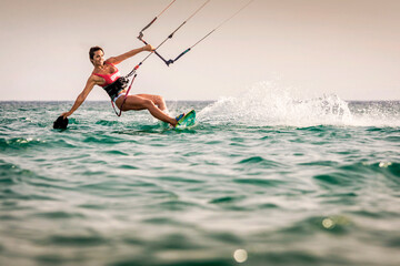 Sexy sportive woman kitesurfing at Los Lances beach, Tarifa, Cadiz province Andalusia, Spain © inigolaitxu