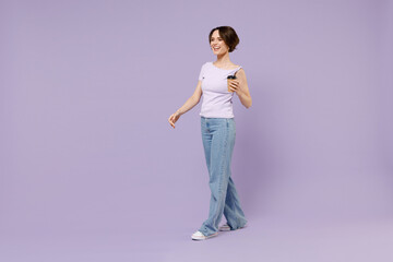 Full length side view young smiling fun happy woman 20s wear white t-shirt hold takeaway delivery...