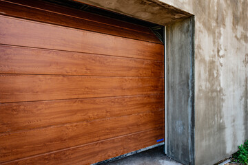 Brown automatic sectional metal garage doors.