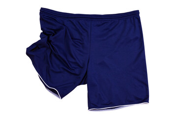 Folded dark blue sport shorts isolated on white, running shorts close up .