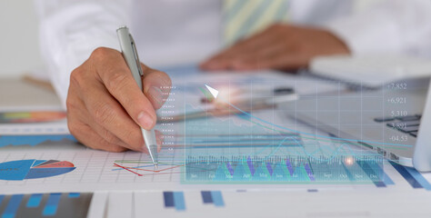 Financial Business man analyze the graph of the company's performance to create profits and growth,Market research reports and income statistics,double exposure with Financial Accounting concept.