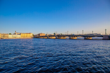 Fototapeta na wymiar View of the river, panorama of the summer sunset St. Petersburg. Russia. Blagoveshchensky Bridge, Neva River, English Embankment, Sphinxes of the Academy of Arts, Vasilievsky Island.
