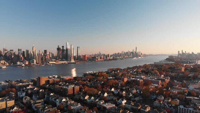 Manhattan skyline and Hudson River. Camera ascending.