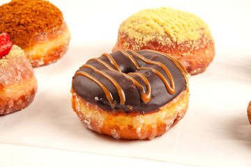 Set of special handmade brioche chocolate with caramel frosting doughnut desserts