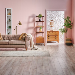 Pink and white brick wall background bookshelf wooden cabinet and green plant, interior style. © UnitedPhotoStudio