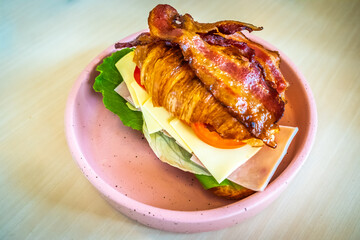 Turkey sandwich on a croissant with swiss cheese