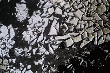 surface of the water is covered with metal oxides