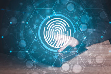 Fingerprint scan provides security human password access with biometrics identification. Cyber security Concept with Businessman using laptop background .