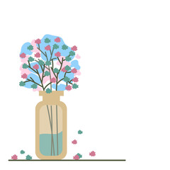 glass jar with small blue and pink flowers