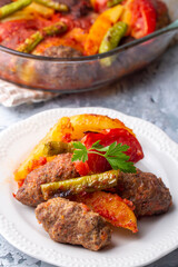 Traditional Homemade Turkish Food Kofte - Kofta with Tomato Sauce and Potatoes. (Turkish name; Izmir kofte)