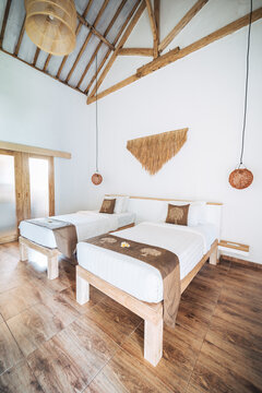 Bedroom interior with beds on parquet in hotel