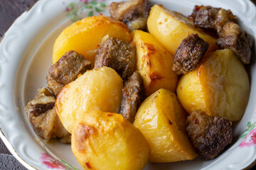 From traditional delicious Turkish food; potato and meat dish in casserole (Turkish name; Guvec tas kebabi, tandir)