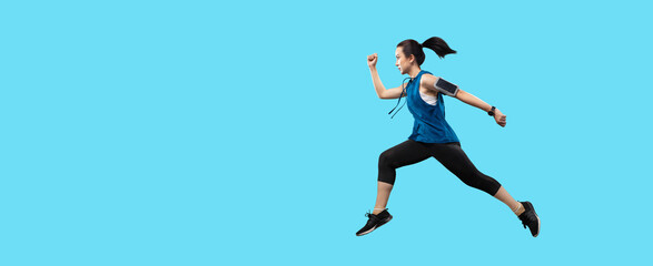 Fototapeta na wymiar Clipping path young Asian active woman running and jumping isolated in studio on banner light blue color background. Isolated healthy women in sportswear workout sprinting.