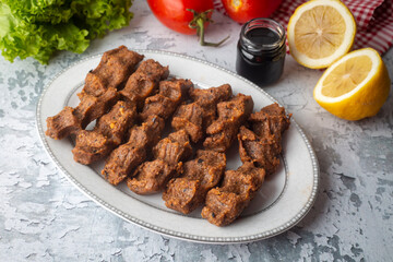 Traditional delicious Turkish food; Turkish name; Cig kofte (raw meatball in Turkish) with lettuce